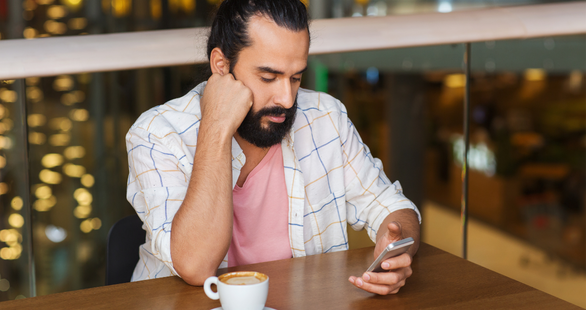 man looking at a phone